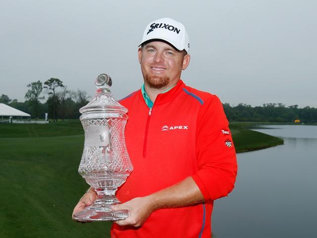 JB Holmes with the Shell Houston Open trophy